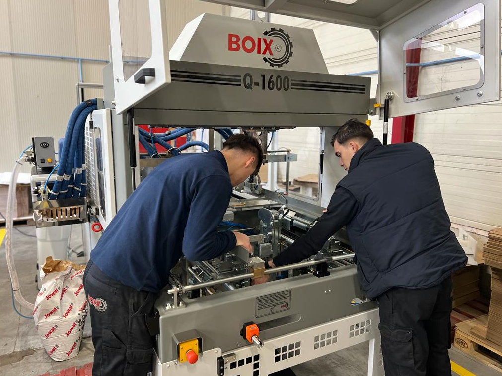 Boix technicians work on the machine