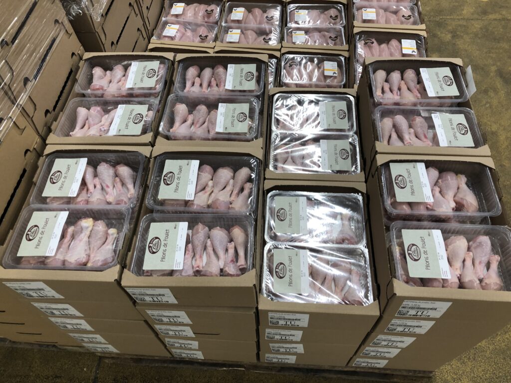 Chicken legs in cardboard trays